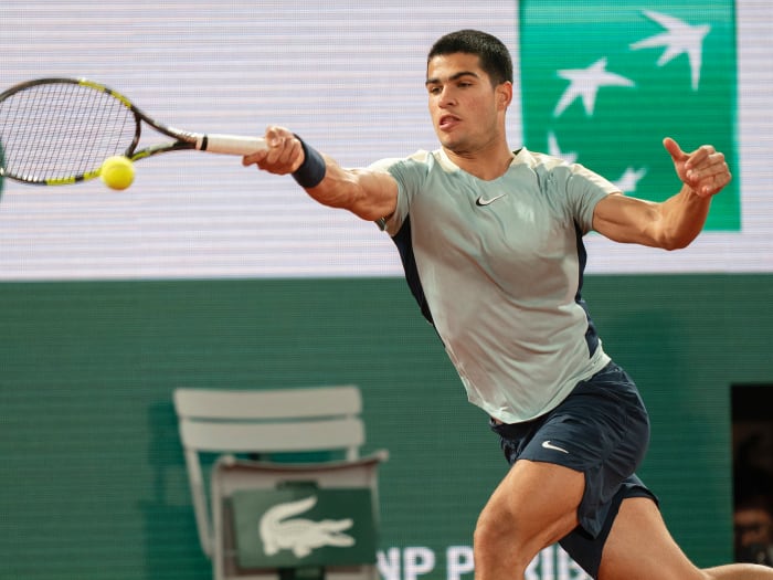 Carlos Alcaraz (ESP) returns a shot from Sebastian Korda (USA) during their match on day six of the French Open at Stade Roland-Garros.